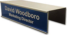 Office nameplate holders for cubicles slide over any cubicle wall to be moved and reused over and over. Many colors available in durable, scratch-resistant metal. Easily slide in nameplates and office signs. NapNameplates.com