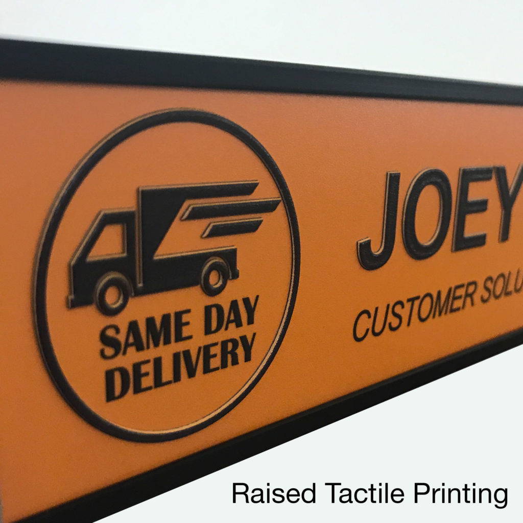 Name plates with tacticle, raised color printing and is ADA compliant - NapNameplates.com